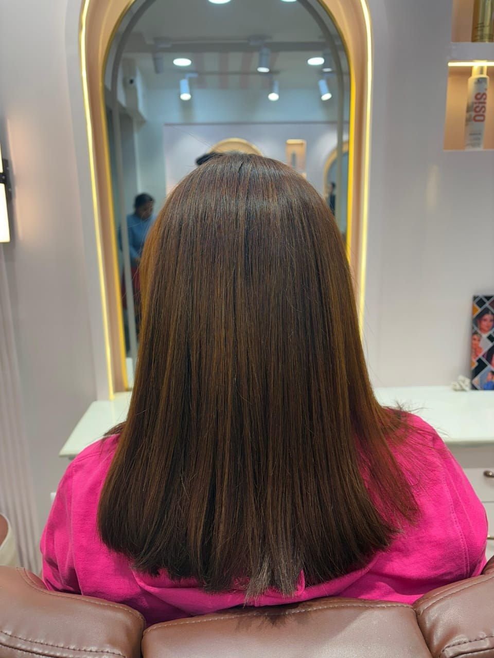 Back view of straight shoulder-length hair with subtle brown tones